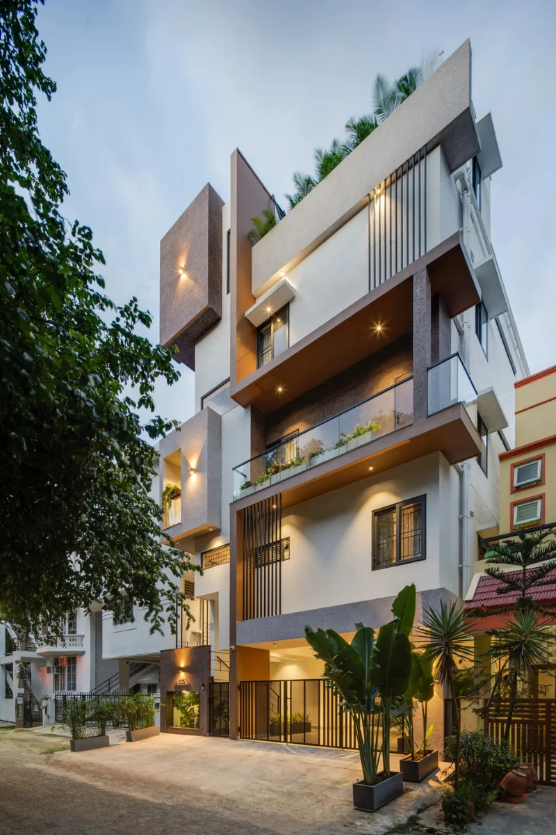 Modern multi-story residential building with cantilevered blocks and glass balconies designed by architects in Bangalore